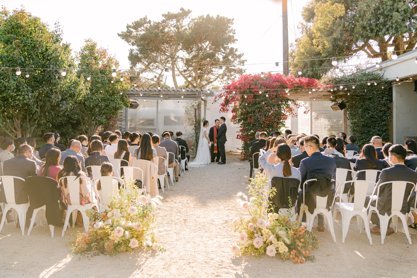 Wedding ceremony on the garden patio at Aracely Cafe