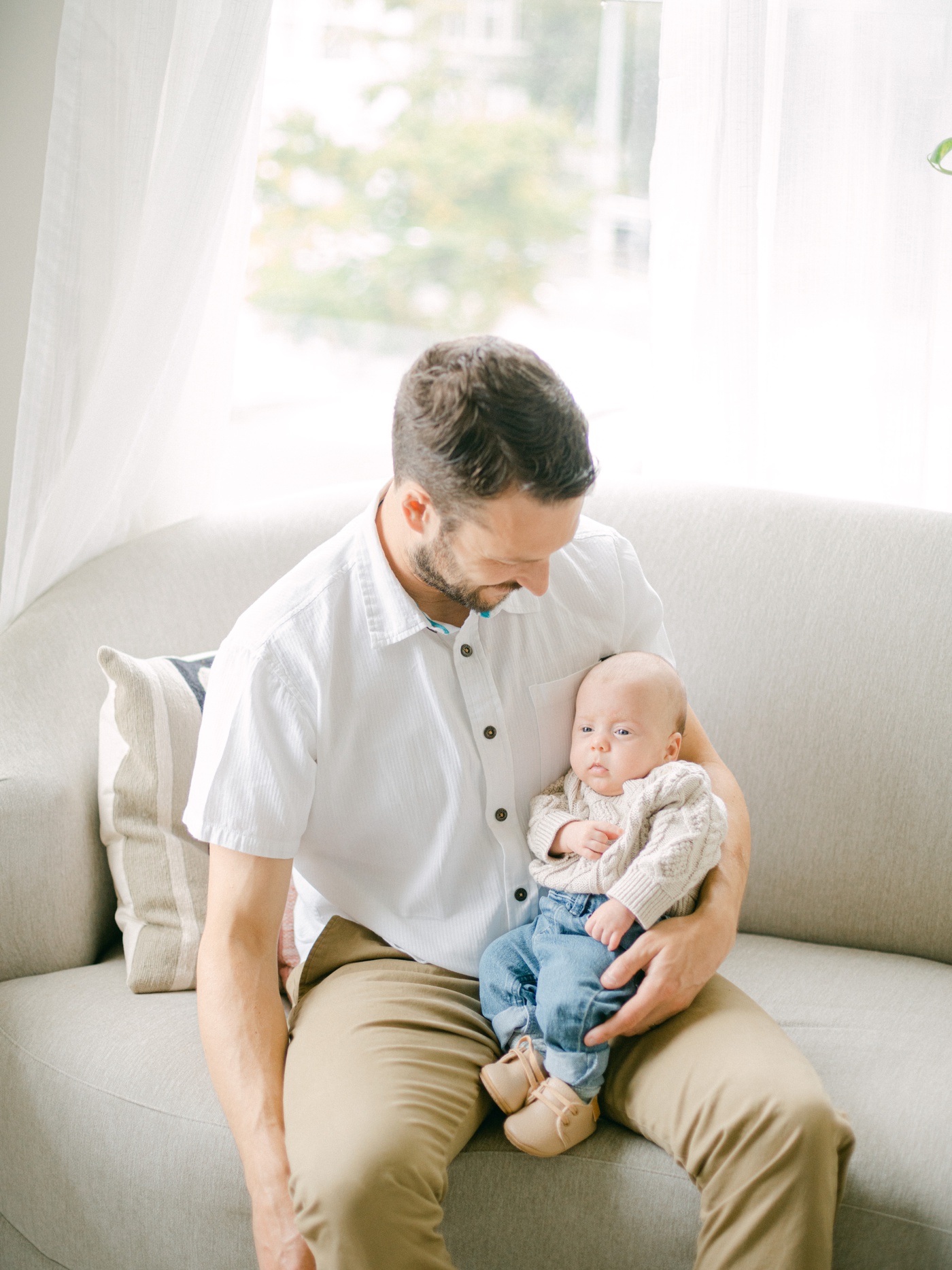Dad in a white button-down shirt and khaki pants for family session